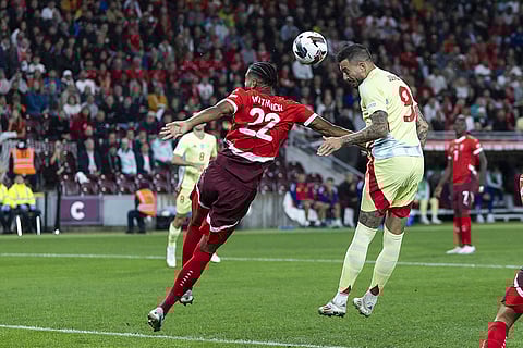 2024–25 UEFA Nations League, Switzerland vs Spain: Switzerland's defender Gregory Wuthrich, left, fight for the ball with Spain's forward Joselu